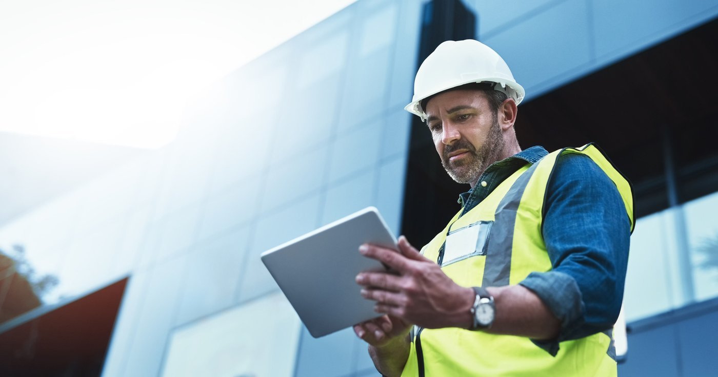 Contractor reviewing a priced BOQ on a tablet